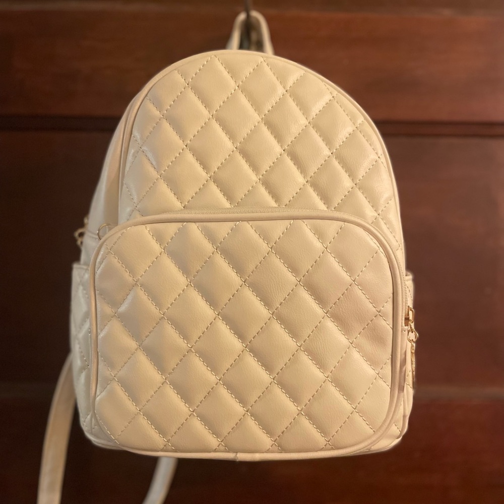 Quilted white “pleather” backpack